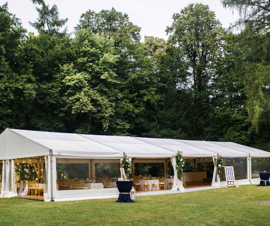 Outdoor wedding setup under a tent