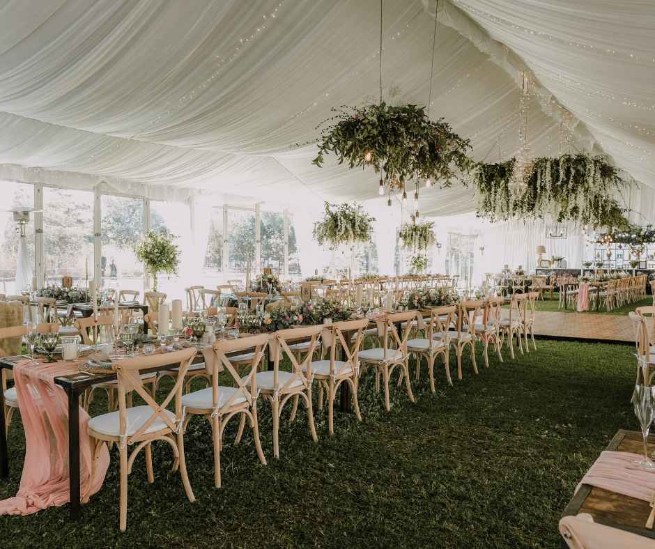 Outdoor wedding reception under a tent